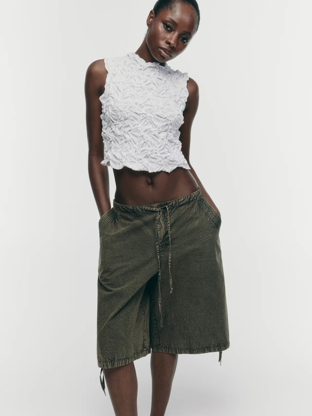 Zara white textured top features a distinctive scrunched or popcorn texture.